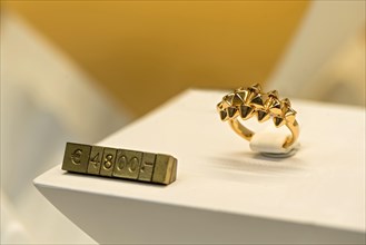 High quality gold ring with price tag