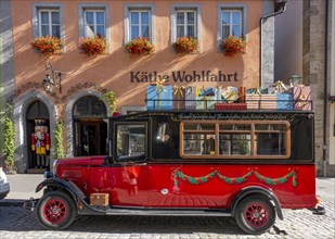 Decorated vintage bus in front of the house of Kaethe Wohlfahrt Christmas Village