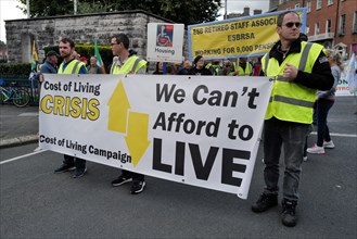 Protestors holding a banner at a Cost of Living Crisis demonstration. Dublin