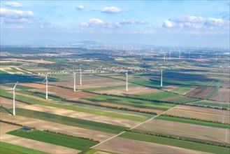 Aerial view of wind turbines on agricultural land in the background large number of wind turbines
