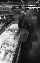 The work of a housewife and mother shopping for groceries at the supermarket and Aldi