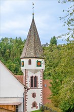 Church tower in green nature