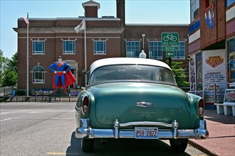 Vintage car in front of the Superman Museum in the historic district of Metropolis