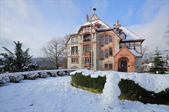 City Hall Villa Bonn built 1860 in the snow with snowman in Kronberg