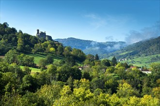 Saint-Ilpize castle perched on a volcanic peak above river Allier. Haute-Loire department. Auvergne-Rhone-Alpes. France