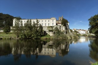Lavoute Chilhac labelled Les Plus Beaux Villages de FrancePriory Sainte-Croix reflecting in the river Allier