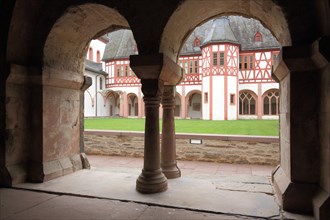 View through chapter house with two archways and columns to the inner courtyard in UNESCO Kloster Eberbach