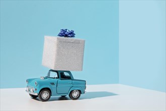 Blue car toy with present