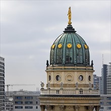 The domed tower of the German Cathedral at Gendarmenmarkt in front of newly built skyscrapers