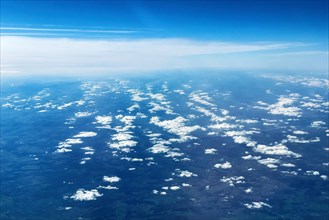 View from aeroplane of cluster clouds Altocumulus clouds Sheep clouds in the background Altostratus