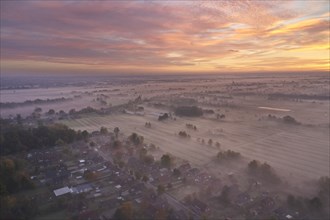 Aerial view of the landscape near Fuenfhausen in Hamburg's Kirchwerder district in autumnal morning atmosphere with light ground fog. In the background the nature reserve Kirchwerder Wiesen. Fuenfhaus...