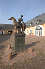 Historical sculpture Late Harvest Rider in the courtyard of Johannisberg Castle