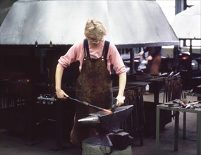 Wolfsburg. Girl in a man's job as an apprentice at VW ca. 1972