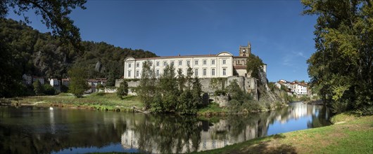 Lavoute Chilhac labelled Les Plus Beaux Villages de FrancePriory Sainte-Croix reflecting in the river Allier