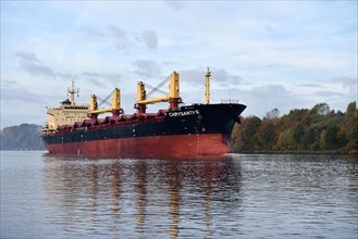 Cargo ship Chrysanthe sails through the Kiel Canal in autumn