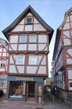 Narrow half-timbered house and bookshop