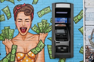 ATM in the Cherokee Lemp Historic District next to mural