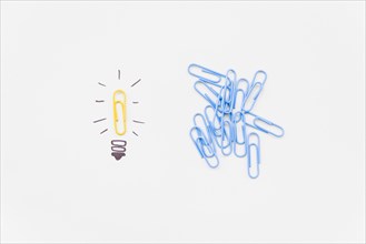 Bulb drawing with yellow paperclip as light