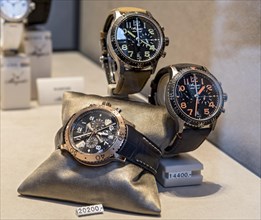 High-quality watches of the luxury brand Breguet in the shop window with price tag