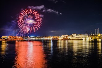 Illuminated town with fireworks