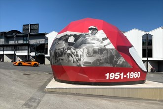 Open Air Museum Exhibition room with exhibition on racing history in the form of walk-in giant helmet with dates from decade 1951 to 1960 Fifties