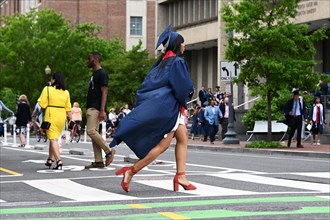 George Washington University college student in traditional robe and mortarboard on her graduation day