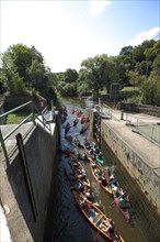 Lock with canoeist on the Lahn at the shipping tunnel