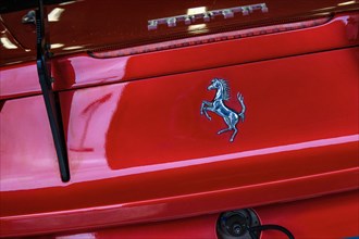 Ferrari emblem logo trademark rearing horse Cavallino Rampante on rear of red Italian sports car Ferrari 458 Challenge