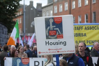 A placard demanding housing and disability equality at a cost of living crisis demonstration. Dublin