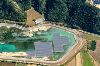 Aerial photo photovoltaics on a water retention basin in the French Alps near Lazer