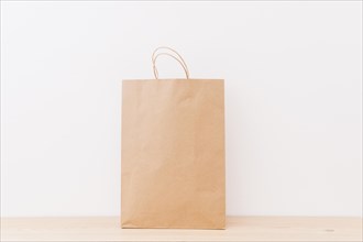 Brown shopping bag wooden surface