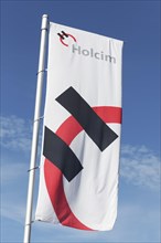 Flag with logo of Holcim AG