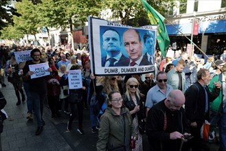Protestors at a Cost of Living Crisis demonstration in Dublin city centre carrying a banner condemning the Irish Taoiseach Micheal Martin and other government politicians Leo Varadkar and Eamon Ryan. ...