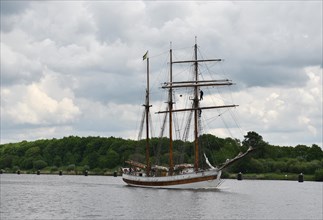 Three-master sailing through the Kiel Canal