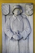 Stone relief of a soldier in the First World War in the Seelenkapelle from 1492