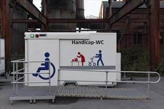 Handicap WC with pictograms for wheelchair and rollator at Piazza Metallica