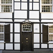 Half-timbered house with beautiful door on Tuchmacherplatz