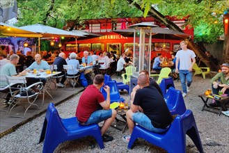 People in the beer garden Republic-Berlin with beer ambulance