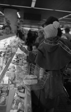 The work of a housewife and mother shopping for groceries at the supermarket and Aldi