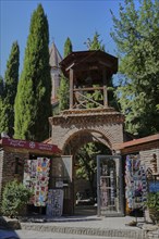 Entrance and bell tower with kiosk in front of Jvaris Mama Church