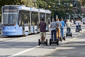 Tourists on sightseeing tour with Segway