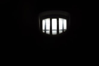 View into dark prison cell