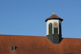 Ridder with clock on the roof of the Landesmusikakademie