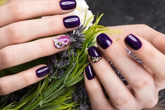 Shot beautiful manicure with flowers on female fingers. Nails design. Close-up. Picture taken in the studio on a white background