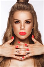 Beautiful young woman with bright makeup and neon pink nails. Beauty face. Photo taken in the studio