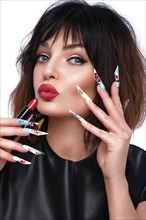 Photo of surprised woman in pop art style and design manicure with lipstick in hand. Creative nails