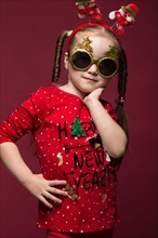 Funny little girl in the New Year's image