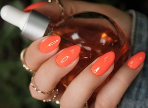 Bright neon manicure on female hands with accessories. Nail design. Beauty hands