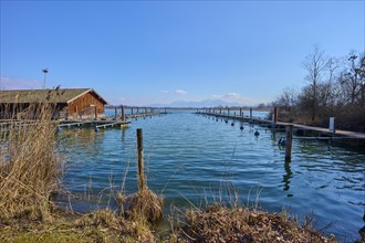 Lake Ciemsee with boathous and jetty
