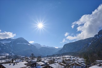 Mountain range with Jenner mountain and sun in winter